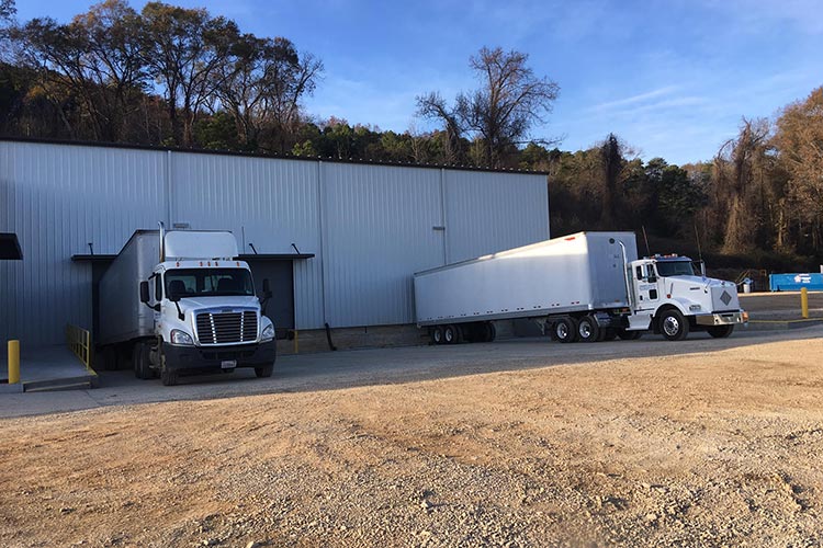 Delivery trucks outside warehouse